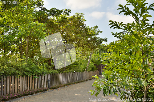 Image of Country road along a wooden fence