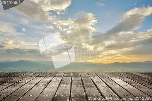 Image of City sunset with wooden ground