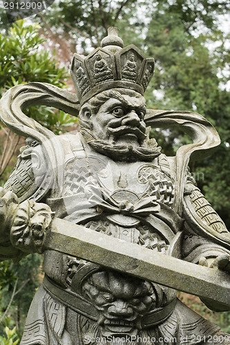 Image of Aged asian god statue