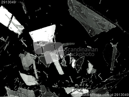 Image of Shattered glass pieces on black background