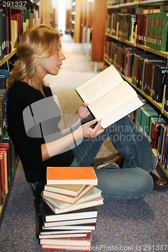 Image of girl reading in the library