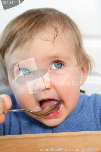 Image of baby with a spoon