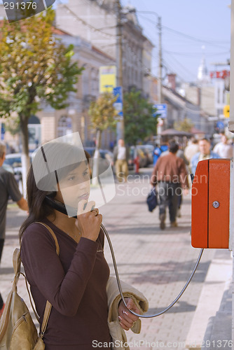 Image of Woman at the public phone