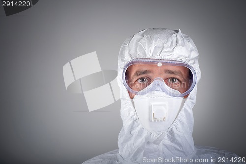 Image of Scientist in protective wear, glasses, respirator