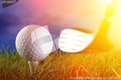 Image of Golf club and ball in grass