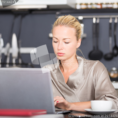 Image of Business woman working from home.