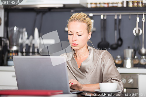 Image of Business woman working from home.