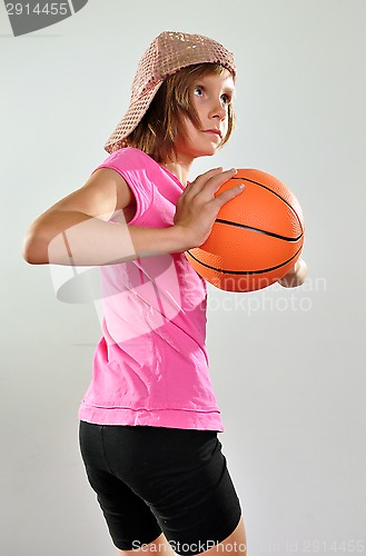 Image of child playing basketball 