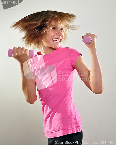 Image of child exercising with dumbbells