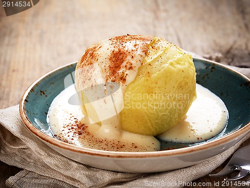 Image of baked apple dessert with vanilla sauce