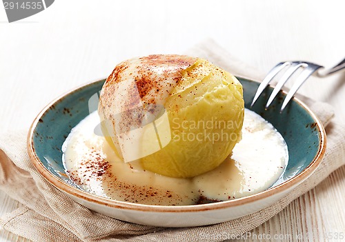 Image of baked apple dessert with vanilla sauce