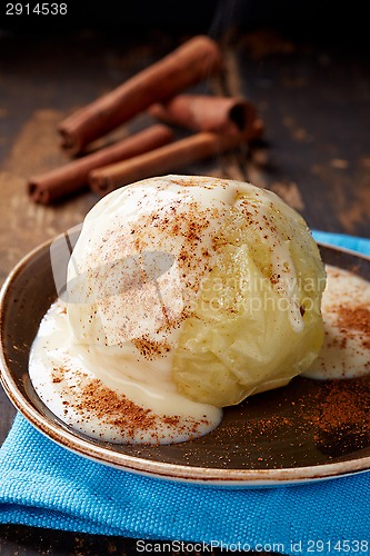 Image of baked apple dessert with vanilla sauce