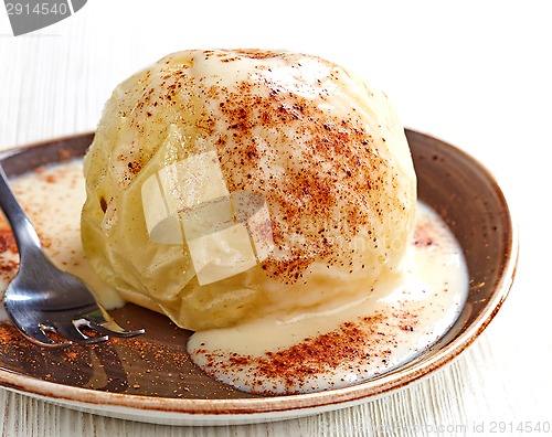 Image of baked apple dessert with vanilla sauce
