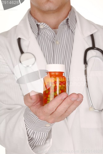 Image of Doctor With Medication in Prescription Bottles