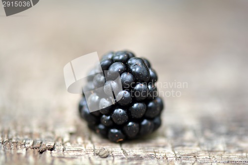 Image of Blackberries on wooden plate - closeup