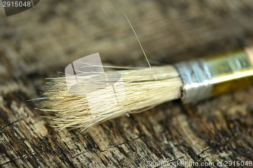 Image of Paint brush on a old wooden background