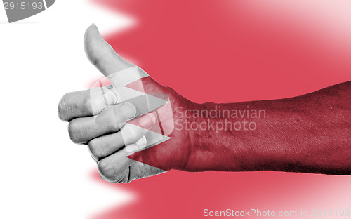 Image of Old woman with arthritis giving the thumbs up sign