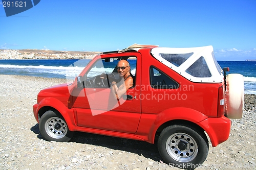 Image of Man in red jeep