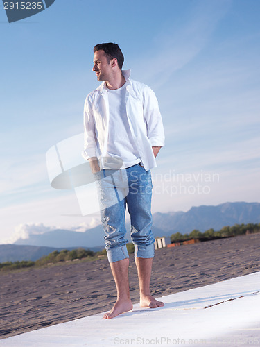 Image of young couple  on beach have fun