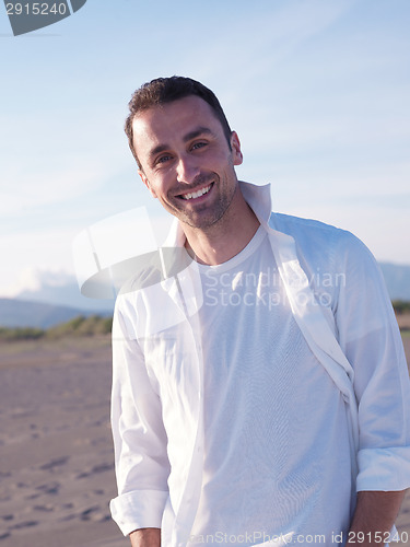 Image of young couple  on beach have fun