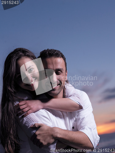 Image of young couple  on beach have fun