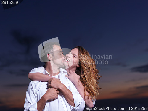 Image of young couple  on beach have fun