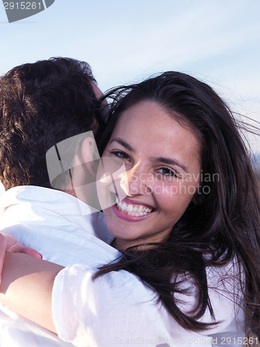 Image of young couple  on beach have fun