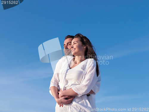 Image of young couple  on beach have fun