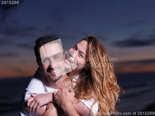 Image of young couple  on beach have fun