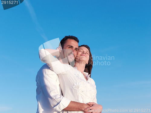 Image of young couple  on beach have fun