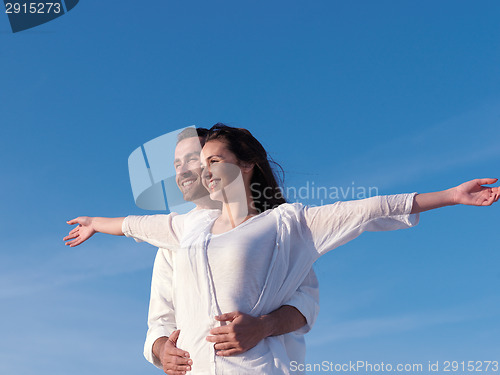 Image of young couple  on beach have fun
