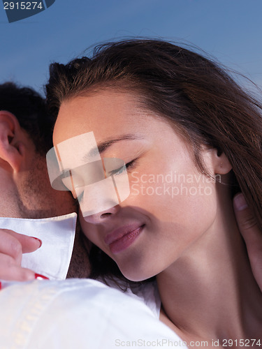 Image of young couple  on beach have fun