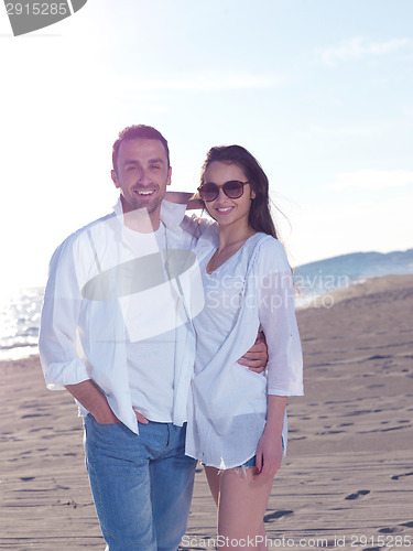 Image of young couple  on beach have fun