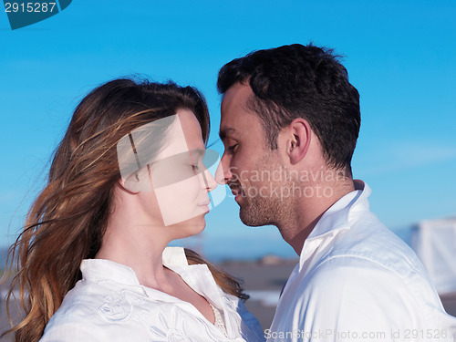 Image of young couple  on beach have fun