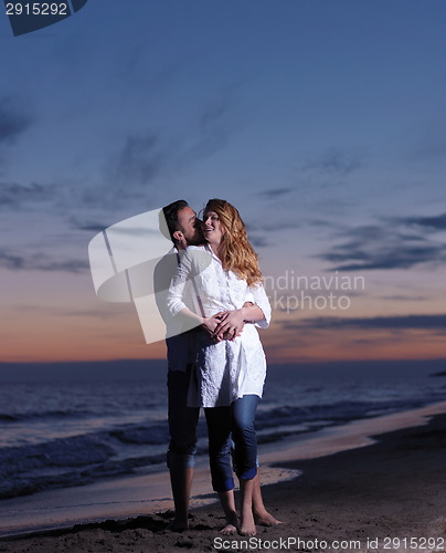 Image of young couple  on beach have fun