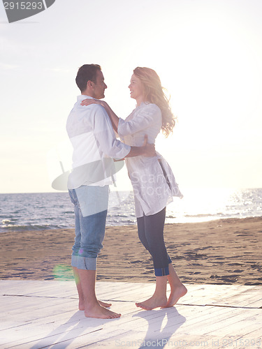 Image of young couple  on beach have fun