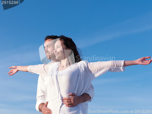 Image of young couple  on beach have fun