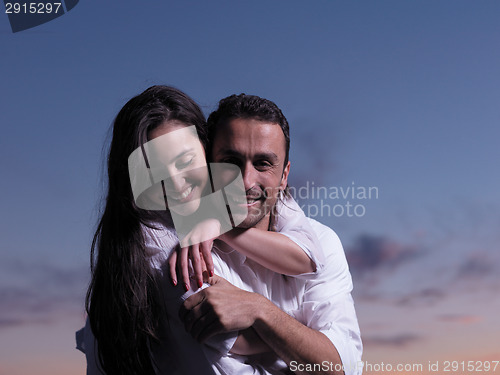 Image of young couple  on beach have fun