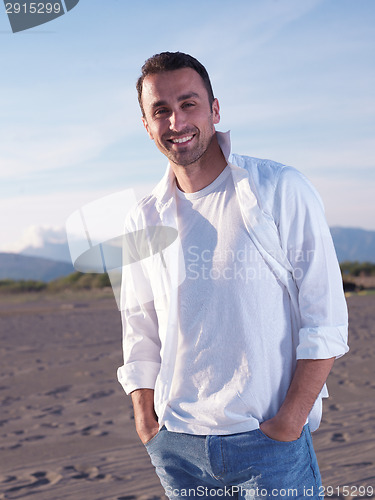 Image of young couple  on beach have fun