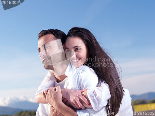 Image of young couple  on beach have fun