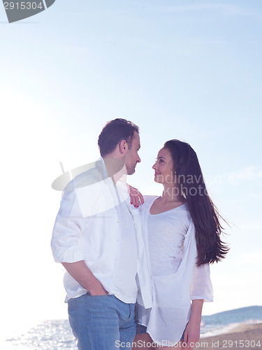 Image of young couple  on beach have fun