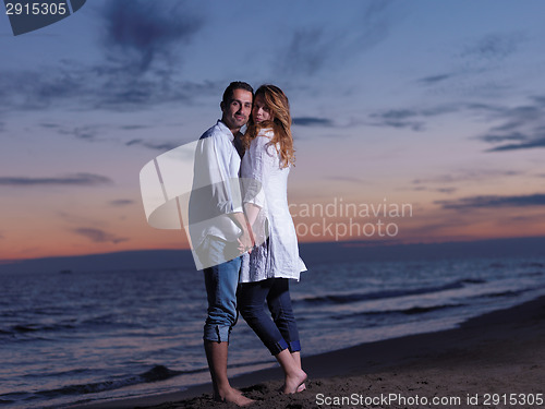 Image of young couple  on beach have fun