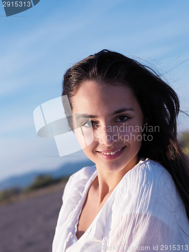Image of young couple  on beach have fun