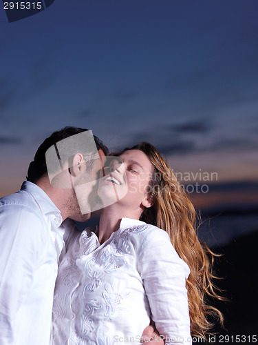 Image of young couple  on beach have fun