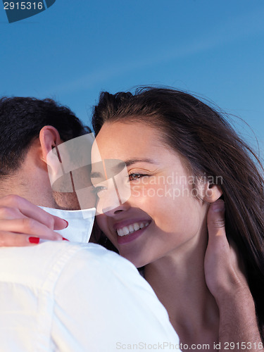 Image of young couple  on beach have fun