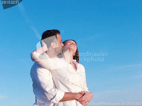 Image of young couple  on beach have fun