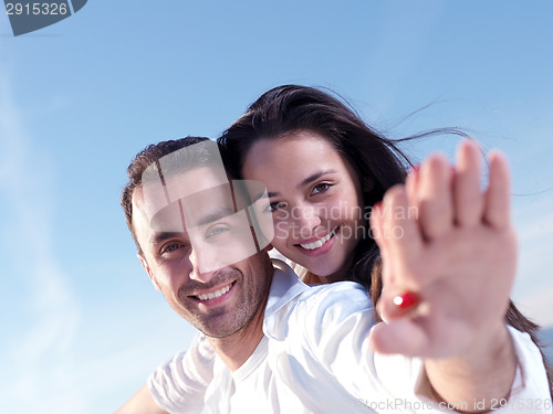 Image of young couple  on beach have fun