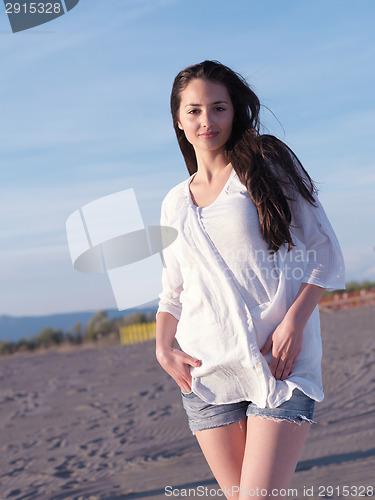 Image of young couple  on beach have fun