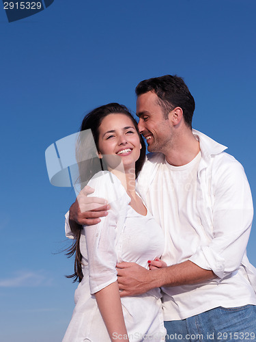 Image of young couple  on beach have fun