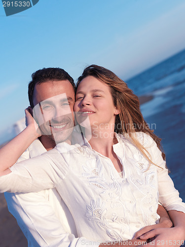 Image of young couple  on beach have fun
